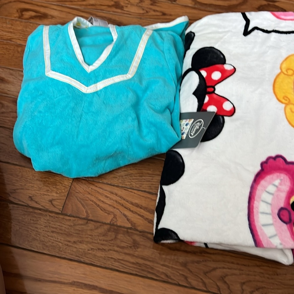 Disney, characters towel and blue frozen cover up with hood. Both NWT